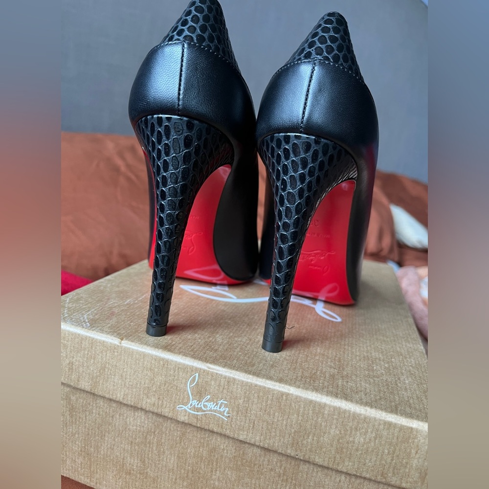 Selling these black stiletto red bottoms for 500! Worn 3 times. Good condition